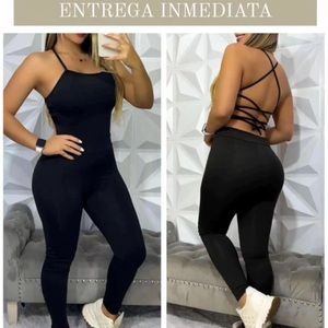 black jump suit, form fitting stretchy back with straps, sexy great for summer